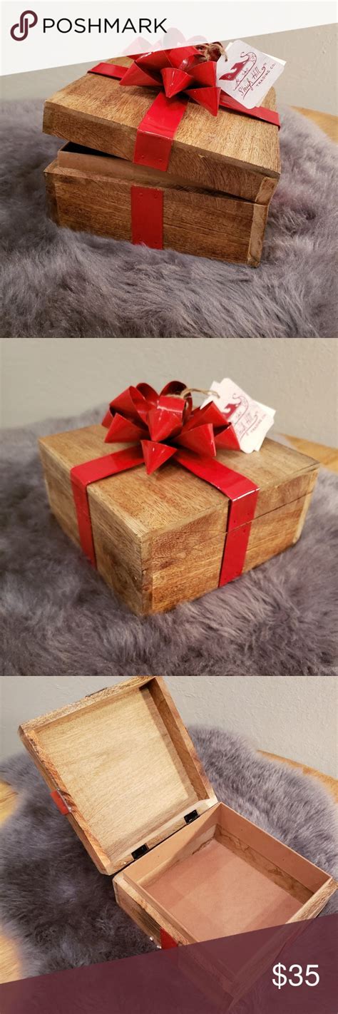 wooden box with red metal bow|Wood Box w/ Red Metal Bow .